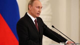 Russian President Vladimir Putin speaks at the Kremlin on 18 March, 2014.