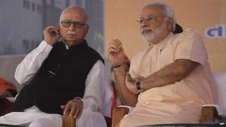Gujarat chief minister and BJP PM candidate Narendra Modi, right, and senior party leader Lal Krishna Advani at the party workers' convention in Gandhinagar on Monday Feb 10, 2014.