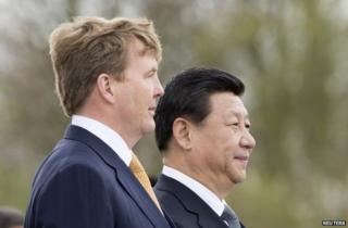 King Willem-Alexander of the Netherlands (left) with Chinese President Xi Jinping at Amsterdam's Schiphol airport, 22 March