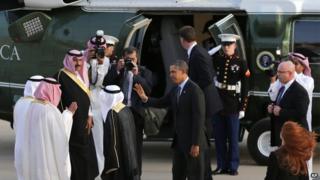 President Barack Obama waves to Governor of Riyadh Prince Khalid Bandar bin Abdul-Aziz Al-Saud and other Saudi officials next to his helicopter in Riyadh, Saudi Arabia, on Friday, March 28, 2014