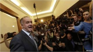 Andrej Kiska reacts as he arrives at the party election headquarters in Bratislava March 29
