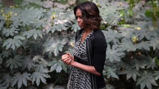 First Lady Michelle Obama listens to a performance on 25 March during a visit to China