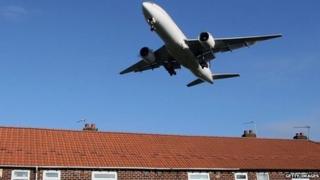 Aircraft over housing