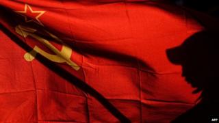 Man waves a Soviet Union flag in Simferopol (16 March 2014)