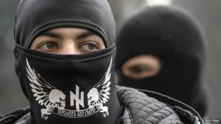 Members of Right Sector stand outside the parliament in Kiev - 28 March 2014