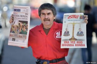 A vendor sells newspapers in the streets of San Jose on February 3, 2014 a day after Costa Rica held presidential elections