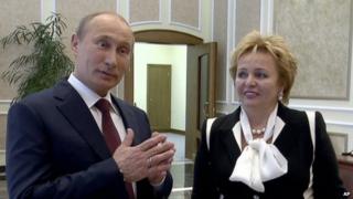 Russian President Vladimir Putin, left, and his wife Lyudmila speak to journalists on Russian TV, June 2013