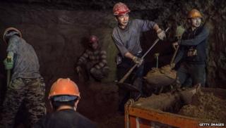 Workers build a subway in Beijing