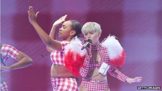 Miley Cyrus performing on stage as part of her Bangerz tour