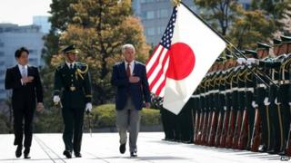 US Secretary of Defence Chuck Hagel (right) reviews honour guards accompanied by Japanese Defence Minister Itsunori Onodera