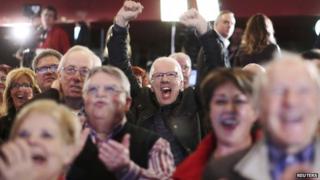 People cheer at the Quebec Liberal leader Philippe Couillard's provincial election rally headquarters in St. Felicien, Quebec, 7 April 2014