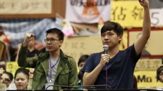 Lin Fei-fan, left, and Chen Wei-ting, leaders of the student protests against a trade pact with China, speak to the media during a press conference on the occupied legislature floor in Taipei, Taiwan, Monday, April 7, 2014.