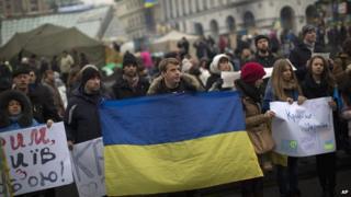 Protesters in Kiev fly Ukraine's flag as they demonstrate against Russia's interference in the country - 1 March 2014