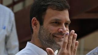 Rahul Gandhi, vice president of India's ruling Congress party, shows his ink-marked finger after casting his vote at a polling station in New Delhi April 10, 2014.