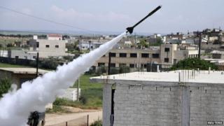 Free Syrian Army fighters launch a homemade rocket at regime forces - 10 April 2014