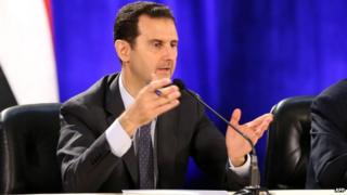 Syrias President Bashar al-Assad addressing faculty members and students during a visit at the Faculty of Political Sciences in Damascus