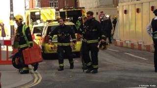 Emergency workers attend the scene of where a construction worker died