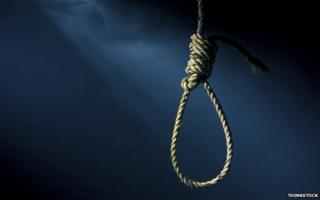 A noose on a dark background