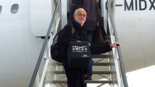 Peter Hodes boarding a plane