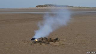 Flames from a device found on Holkham beach