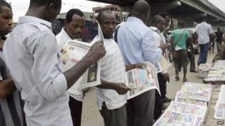 People reading newspapers in Nigeria - 2010