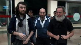 The four French journalists were pictured at a Turkish police station near the border with Syria - 19 April 2014