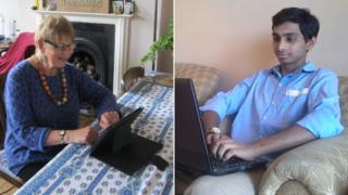 Fewings looking at a tablet and Khan using a laptop