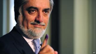 In this photograph taken on April 5, 2014, Afghan Presidential Candidate Abdullah Abdullah shows his inked finger as he casts his vote at a local polling station in Kabul