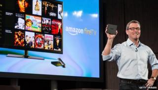 Amazon TV screen with man holding device