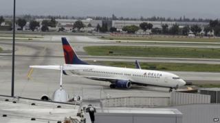 A plane taxis after landing at Mineta San Jose International Airport, 21 April 2014