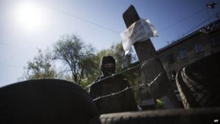 A man behind a barricade outside local government buildings in Horlivka