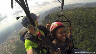 Two people paragliding in Ghana in 2013