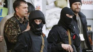 Pro-Russia activists outside seized office of state security service in Luhansk, eastern Ukraine. 25 April 2014