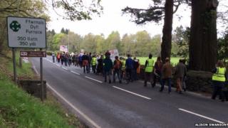 Villagers from Glandyfi, Eglwysfach and Furnace march about pavements