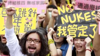 Activists shout slogans during an anti-nuclear protest in front of the Presidential Office in Taipei on 27 April, 2014