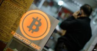 A sign saying Bitcoins accepted here
