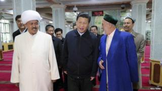 President Xi Jinping (centre) met community leaders in Xinjiang