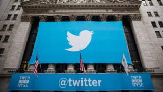 A Twitter banner hangs over the New York Stock Exchange on 7 November, 2013.