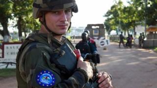A French soldier of the European Union force stands guard at the entrance of Bangui's airport on 30 April 2014