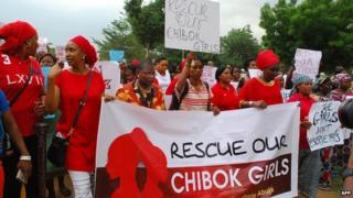 Former Nigerian Education Minister and Vice-President of the World Bank"s Africa division (3r L) Obiageli leads a march of Nigeria women and mothers of the kidnapped girls of Chibok, calling for their freedom in Abuja on April 30, 2014.
