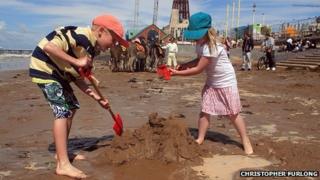Children play on Blackpool beach