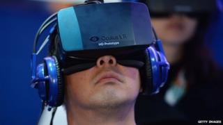 A man wears an Oculus Rift virtual reality headset at a electronics trade show in January 2014.