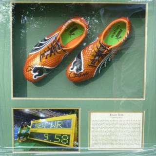 Signed and framed Usain Bolt running shoes