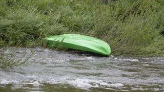 Kayak on riverbank