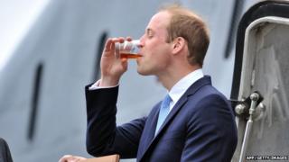 Prince William visiting HMS Alliance at the Royal Navy Submarine Museum in Gosport and drinking rum