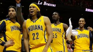 Players from the Indiana Pacers basketball team cheer during a playoff game on 1 May, 2014