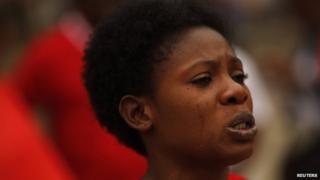 A Nigerian woman cries as she takes part in a protest, called for the release of the abducted secondary school girls from the remote village of Chibok in Nigeria, at La Merced square in Malaga, southern Spain on 13 May 2014
