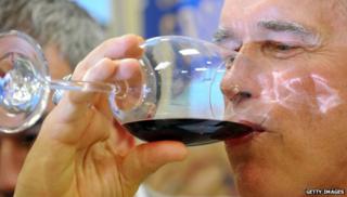 Arnold Schwarzenegger drinking wine
