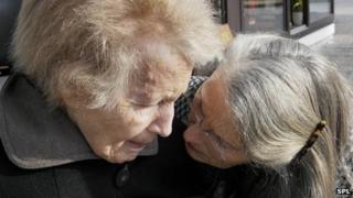 An old woman with Alzheimer's disease and her daughter