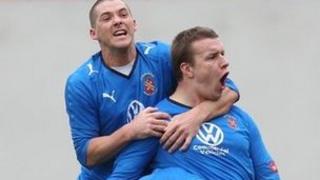 Les Davies of Bangor City celebrates scoring a goal